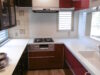 落ち着いた赤のキッチンと概設食器棚との素敵なコラボ!!